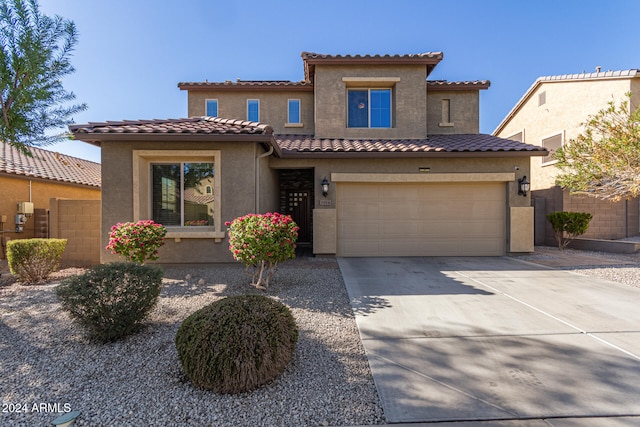 mediterranean / spanish-style house featuring a garage