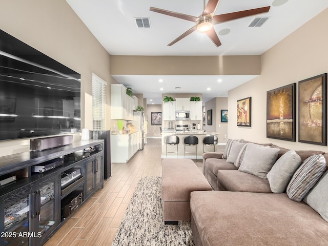 living room featuring ceiling fan