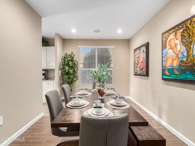 dining area with hardwood / wood-style flooring