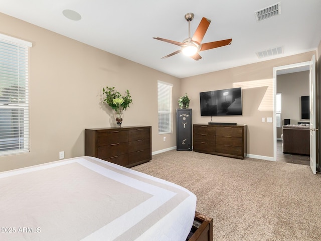 bedroom featuring ceiling fan and light carpet