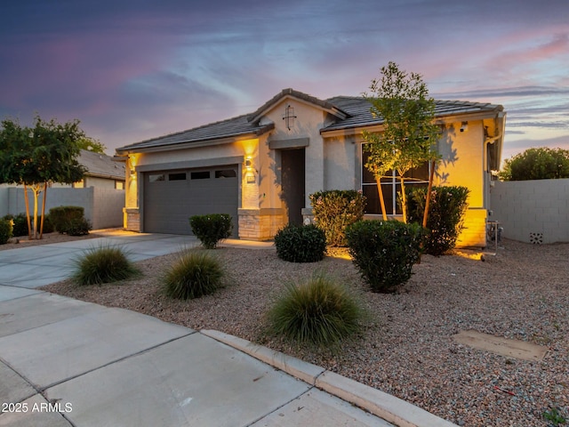 view of front of home with a garage