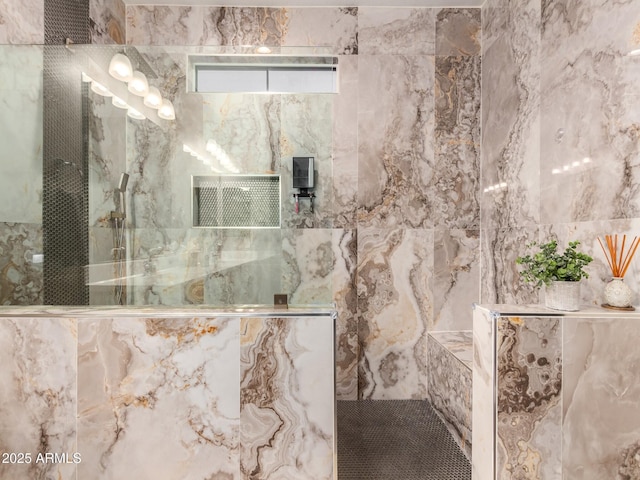 bathroom with tiled shower