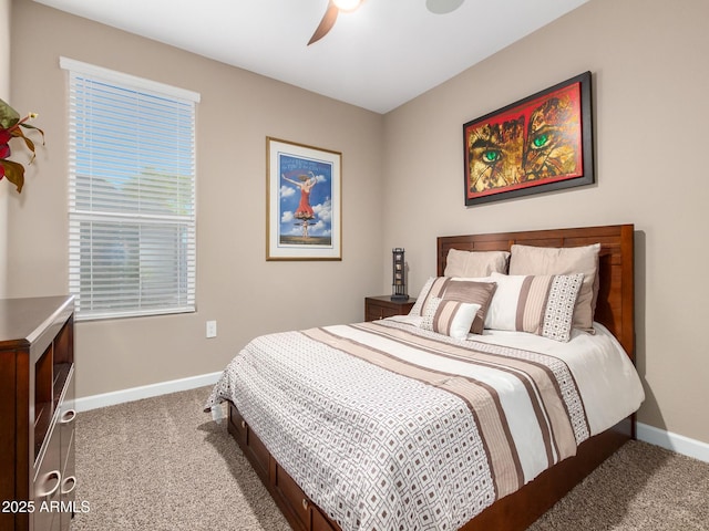 bedroom with ceiling fan and light colored carpet