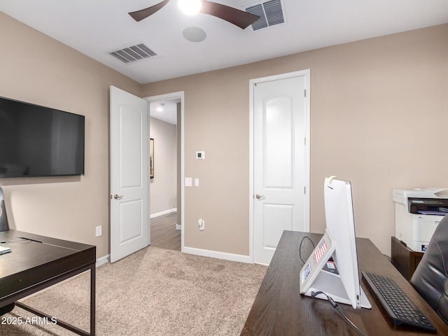 office space featuring ceiling fan and carpet