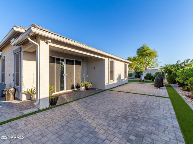 back of house with a patio