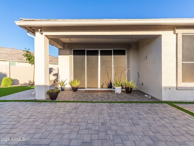 entrance to property with a patio