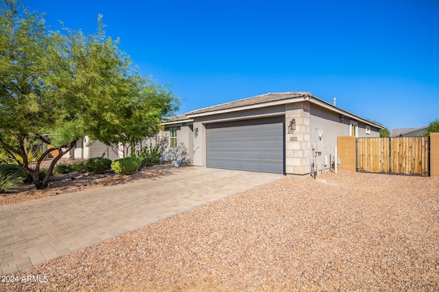 single story home featuring a garage