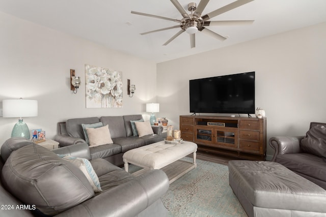 living room with ceiling fan and light wood-type flooring