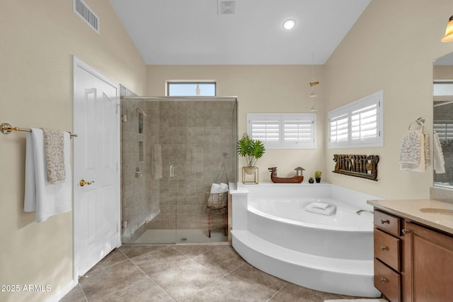 bathroom featuring plus walk in shower, tile patterned flooring, vanity, and lofted ceiling