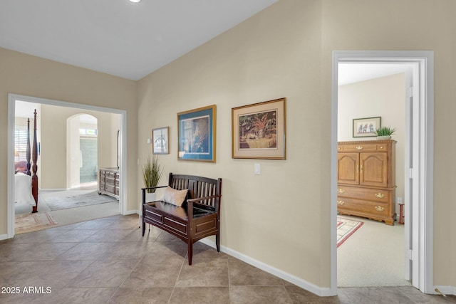 living area featuring light carpet