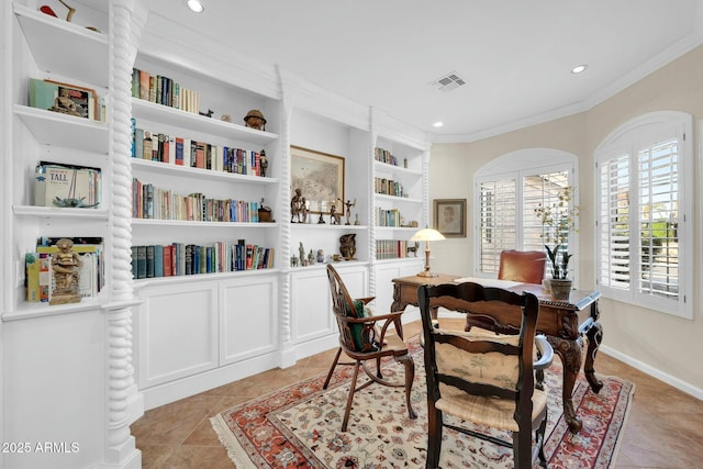 tiled dining room featuring built in shelves and crown molding