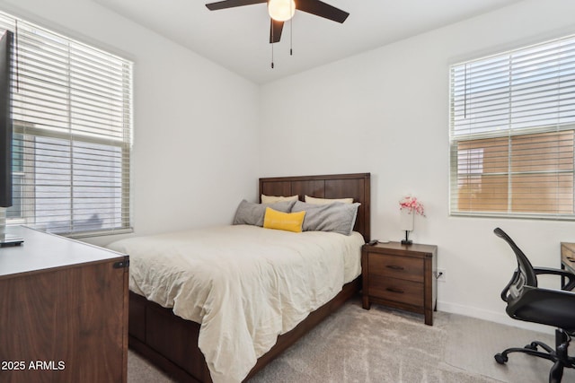 bedroom with carpet, an office area, baseboards, and ceiling fan