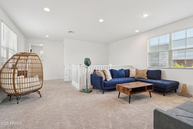carpeted living room with plenty of natural light, recessed lighting, and baseboards