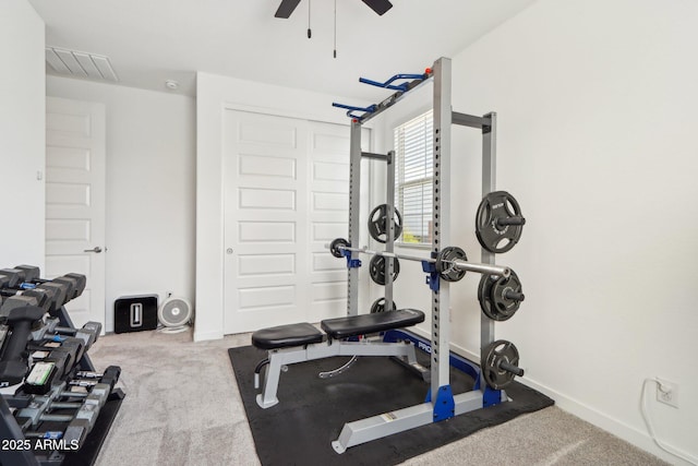 workout room with ceiling fan, baseboards, and carpet