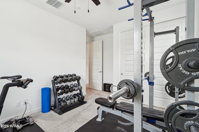 exercise area featuring ceiling fan and carpet flooring