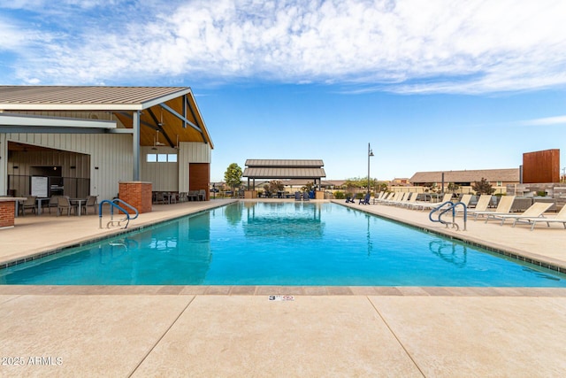 community pool with a patio area
