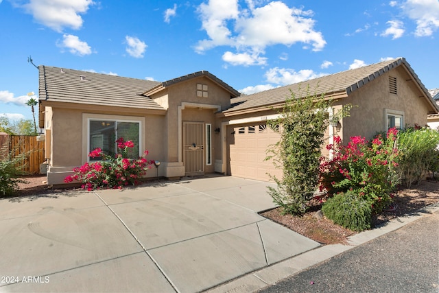 ranch-style house featuring a garage