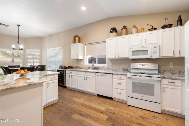 kitchen featuring white cabinets, white appliances, and light wood-type flooring