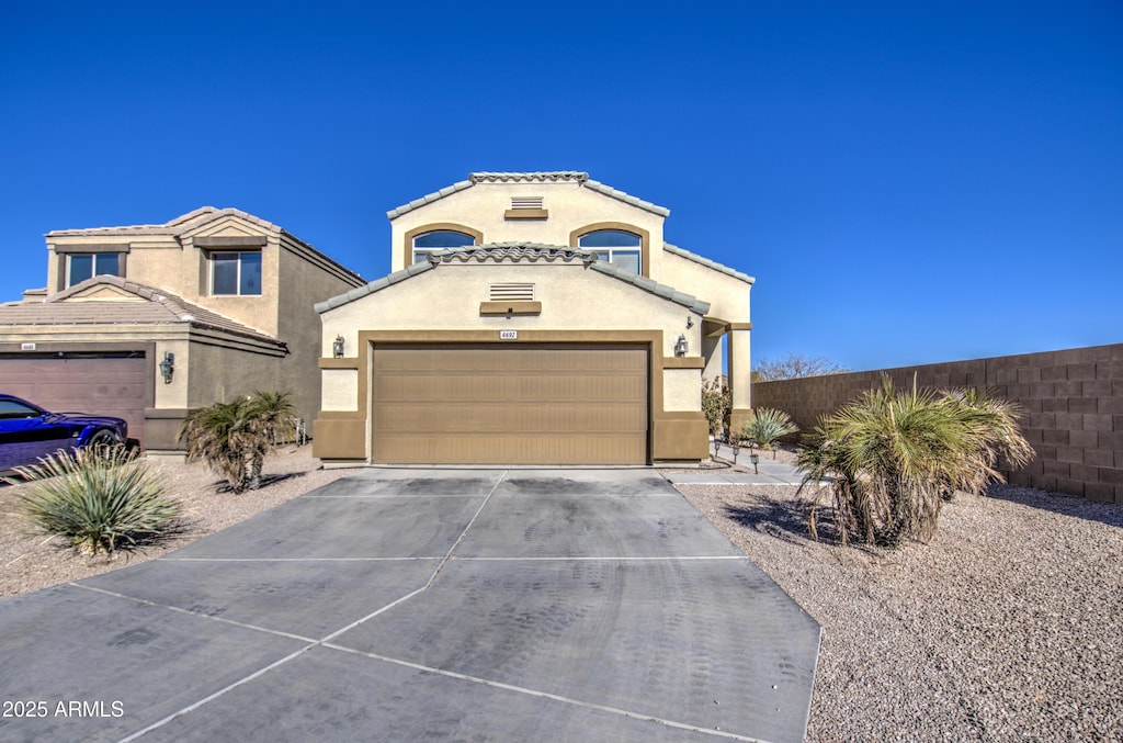 view of front of property with a garage