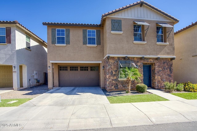 4242 E Erie St, Gilbert, AZ 85295 - view of front of property featuring an attached garage, stucco siding, concrete driveway, and stone siding