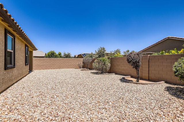 7665 W Fetlock Trl, Peoria, AZ 85383 - fenced backyard featuring a patio area