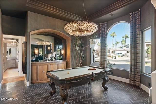 playroom featuring crown molding, pool table, and a raised ceiling