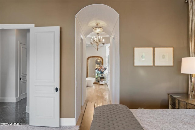 bedroom with an inviting chandelier