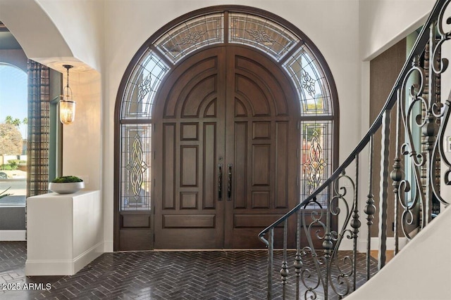 foyer with a towering ceiling and a wealth of natural light