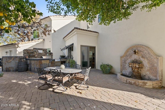 view of patio with exterior kitchen