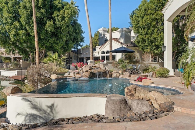 view of pool featuring pool water feature