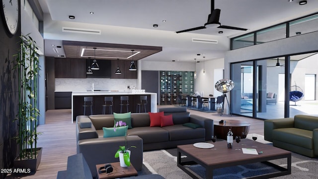 living room featuring ceiling fan, sink, and light hardwood / wood-style flooring