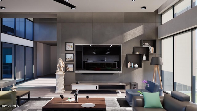 living room with hardwood / wood-style flooring and a high ceiling