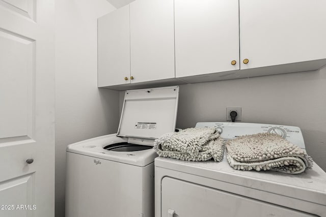 laundry area with cabinet space and washer and dryer