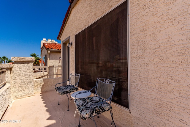 view of patio with a balcony
