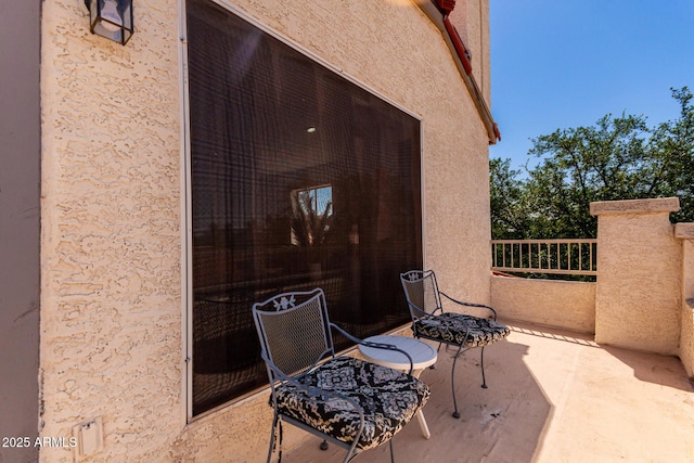 view of patio / terrace with a balcony