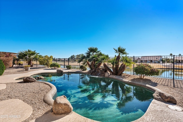 view of swimming pool with a water view