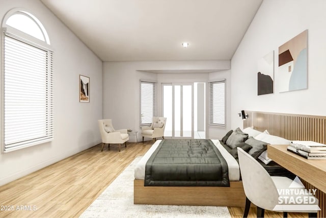 bedroom featuring wood-type flooring and multiple windows