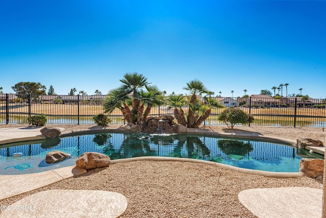 view of pool with a water view