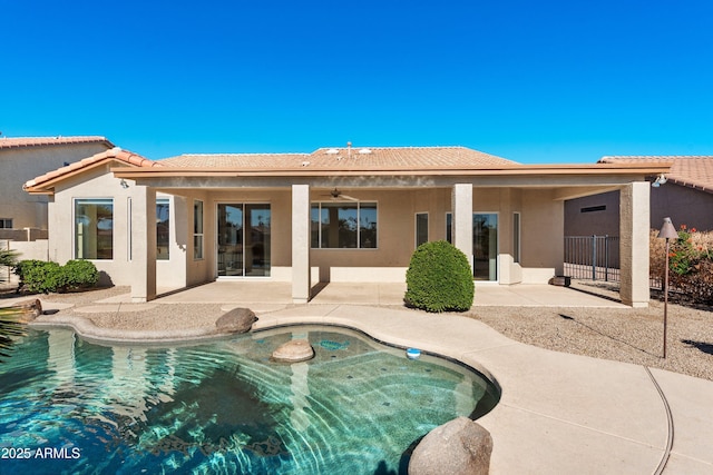 back of house featuring ceiling fan and a patio