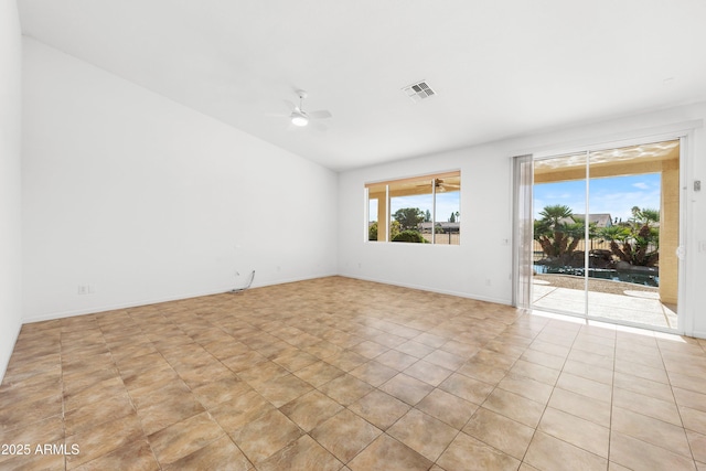 tiled empty room featuring ceiling fan