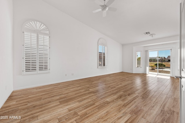 unfurnished living room with ceiling fan, light wood-type flooring, and vaulted ceiling