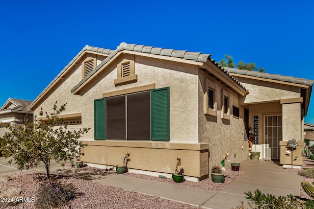 view of property exterior featuring a garage