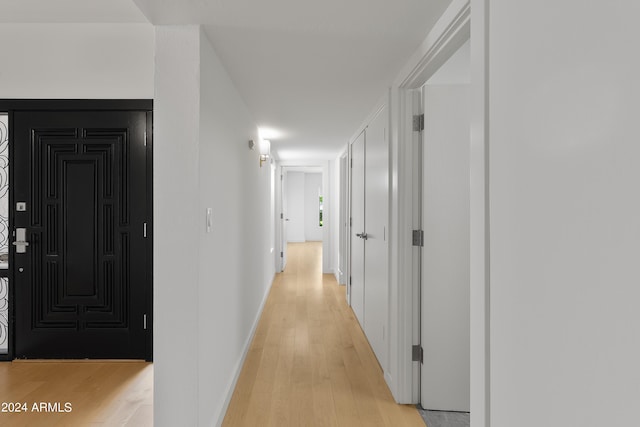 corridor featuring light hardwood / wood-style flooring