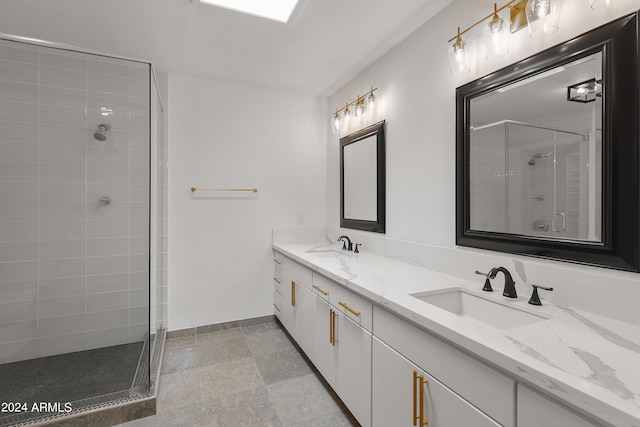 bathroom with vanity and a shower with door