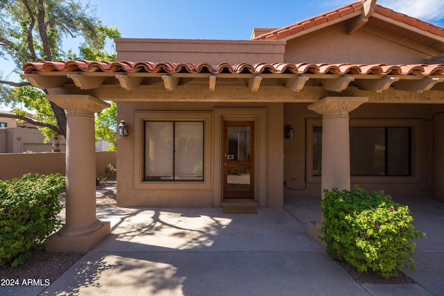 doorway to property with a patio area