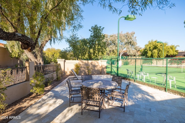 view of patio featuring tennis court