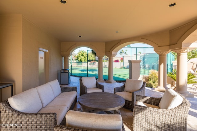 view of patio / terrace with tennis court and outdoor lounge area