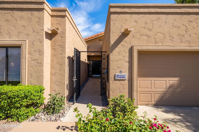 doorway to property featuring a garage