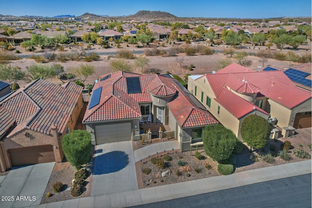 drone / aerial view featuring a mountain view