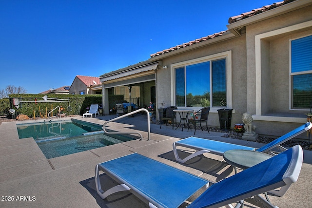 view of swimming pool with a patio area